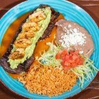 Mar Y Tierra · Charbroiled skirt steak served over our ranchero sauce and topped with grilled shrimp, serve...