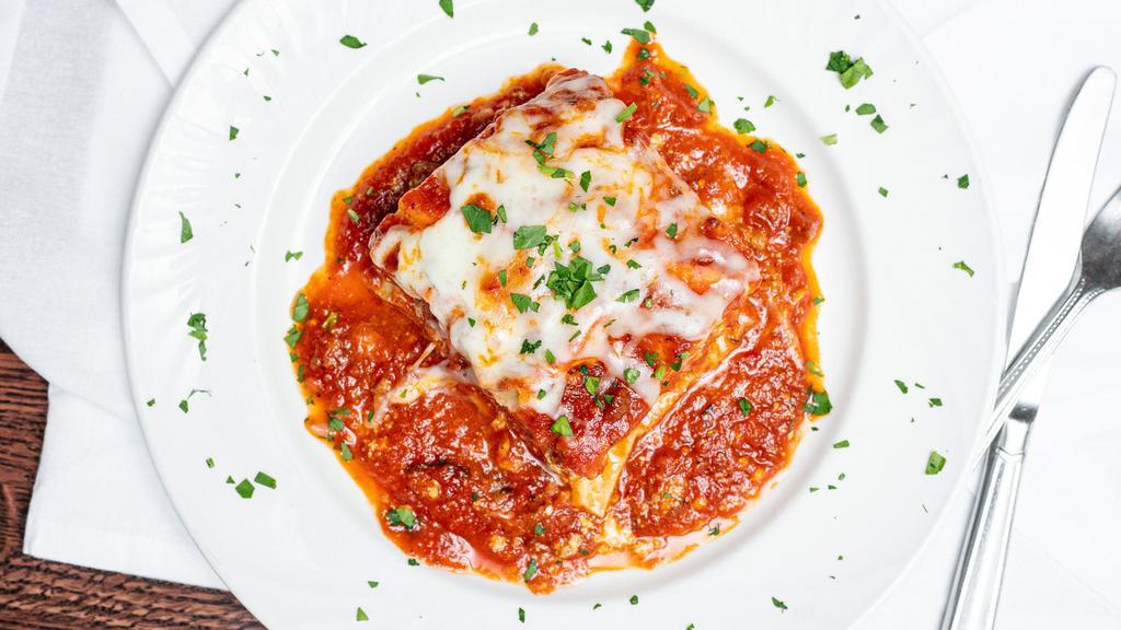 Lasagna · House-made lasagna with ground beef and ricotta
cheese in a delicious meat sauce
