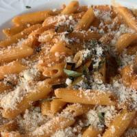 Penne Za Za · Penne pasta with grilled chicken, zucchini,
mushrooms, garlic and onions in a fresh tomato
s...