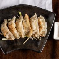 Pork Dumplings · A.K.A. Gyoza. Lightly pan seared to golden perfection, served with a basil soy vinegar sauce.