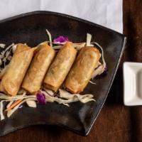 Spring Rolls · Four vegetarian egg rolls, wrapped in rice paper and lightly flash fried.