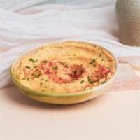Hummus · Garbanzo beans blended with fresh garlic, lemon juice, and tahini drizzled with extra virgin...