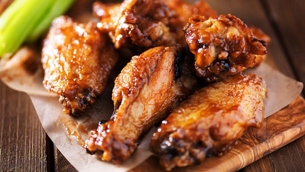Spicy Bbq Bone-In Chicken Wings · Fresh boneless chicken wings tossed in a spicy BBQ sauce.