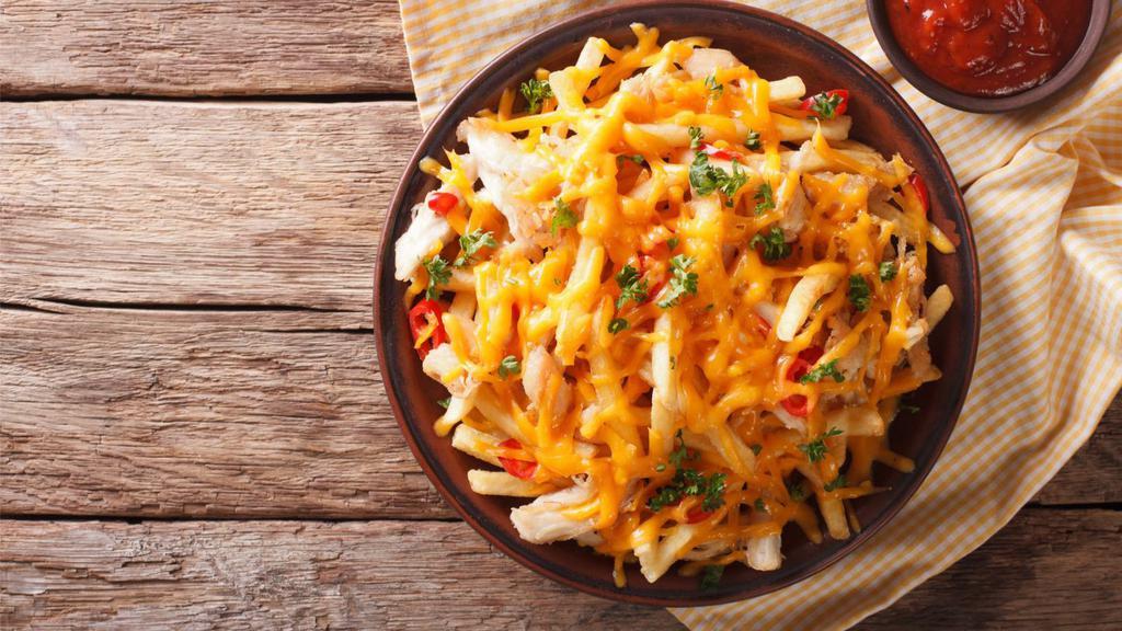 Pizza Fries · Golden french fries topped with savory marinara sauce and shredded cheese.