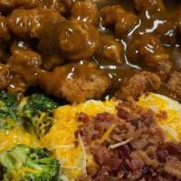 Smothered Steak · Fried steak Smoothed In Brown Gravy. W/ Two Side Items.