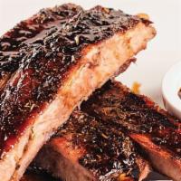 Tuscan Ribs · Marinated pork spare ribs, slow-roasted until tender and served with a tangy Italian-style d...
