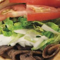Gyro · Thin slices of gyro meat grilled with onions, topped with lettuce, tomato, tzatziki sauce, a...