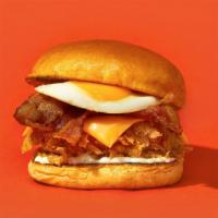 Rise N'Shine · White meat beer battered fried chicken, bacon, cheddar, over easy egg, and sriracha mayo ser...