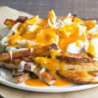Loaded Fries Or Tots · Melted cheddar, green onion, crispy bacon, and sour cream.