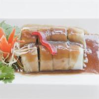 Fresh Salad Roll · Vegetables rolled in rice paper wraps. Served w/sweet sour sauce and peanut sauce. Chicken/t...
