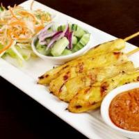 Chicken Satay · Grilled chicken on skewers served w/peanut sauce and cucumber relish.