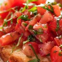 Bruschetta · Diced tomatoes, onions, fresh basil and olive oil, served on toast points topped with grated...