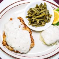 Chicken Fried Steak · Tenderized choice round steak, hand breaded and topped with gravy.