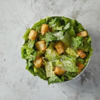 Caesar Salad · Romaine and iceberg lettuce, grated Romano cheese, and croutons all tossed together and topp...
