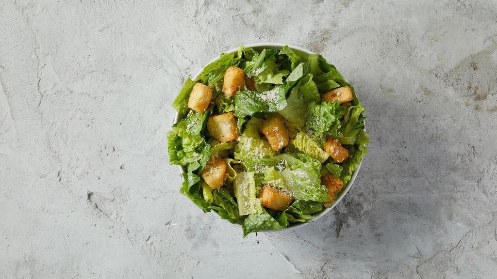 Caesar Salad · Romaine and iceberg lettuce, grated Romano cheese, and croutons all tossed together and topped with Caesar salad dressing.