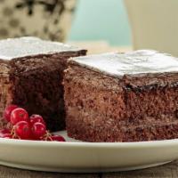 Chocolate Cake · This delicious chocolate cake is fluffy, moist and full of rich chocolate. Cooked and froste...