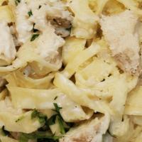 Fettuccini Alfredo · Fettuccini Noodles made in just the right amount of  butter, cream and parmesan cheese. Serv...
