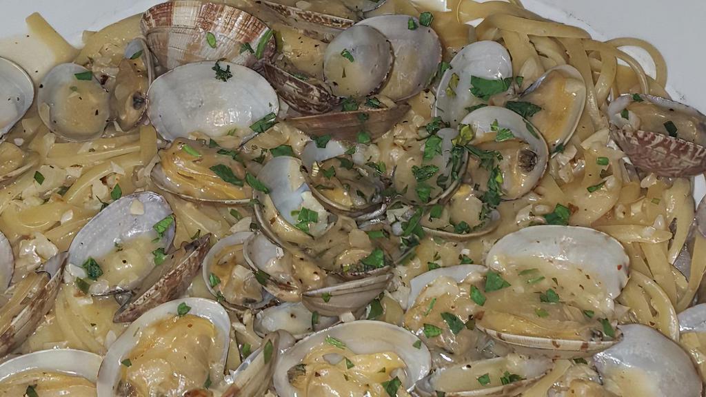 Linguine With Clams · Fresh Clams sauteed in Olive Oil, Garlic, White Wine, Clam Juice, Butter, Fresh Parsley over Linquini. Available  with optional Marinara Sauce
