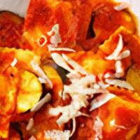 Ravioli · Cheese or Meat filled Ravioli Topped with your choice of Marinara or Meat Sauce. Served with...
