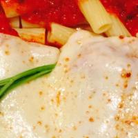 Veal Parmigiana · Served with rigatoni marinara sauce
