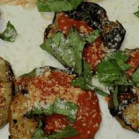 Eggplant Sicilian · Grilled eggplant topped with marinara sauce and basil, served with angel hair pasta with mar...