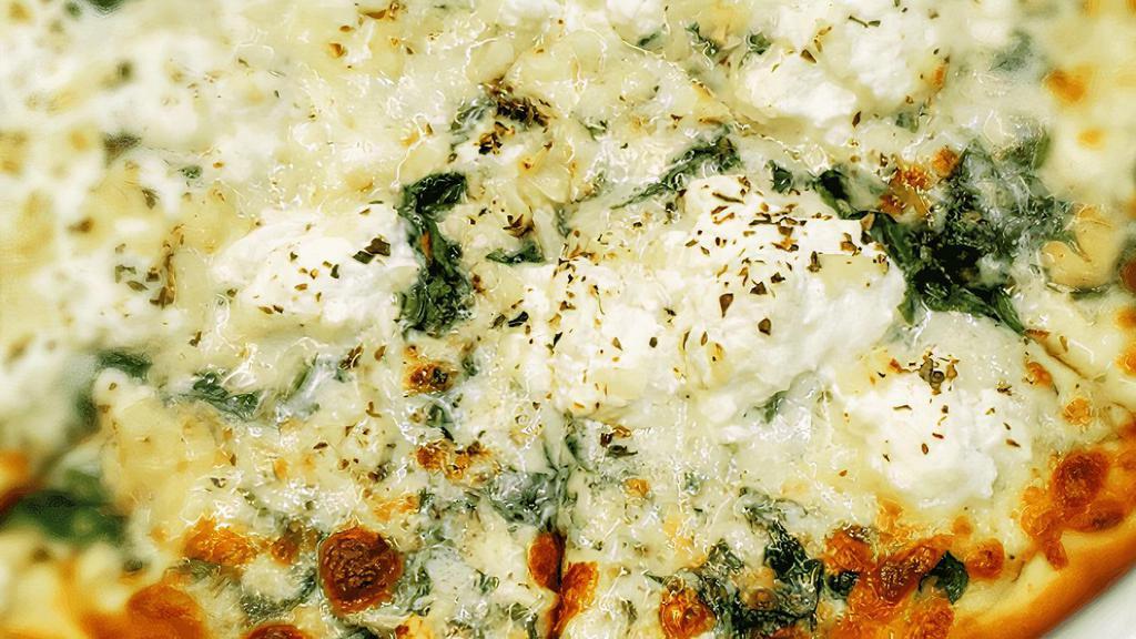White Pizza · Spinach, Ricotta, Fresh Garlic, and Cheese Sauce topped with Mozzarella