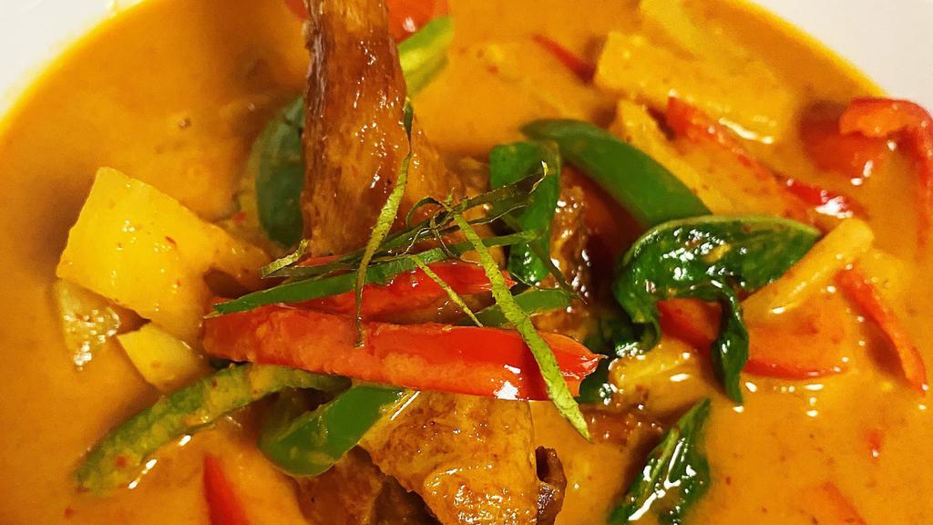 Red Curry · Red chili paste with coconut milk, bamboo shoots, eggplant bell peppers and basil.