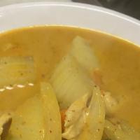 Yellow Curry · Yellow curry paste with potatoes, onions, peas and carrots in coconut milk