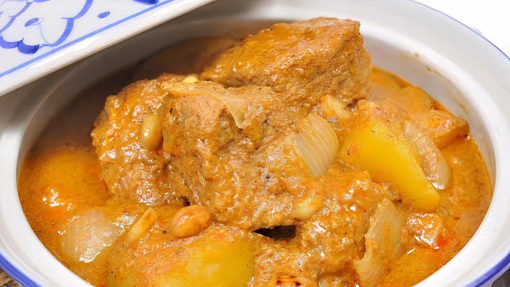 Massaman Curry  · Massaman curry paste with potatoes, onions, carrots, peanuts and pineapple in coconut milk