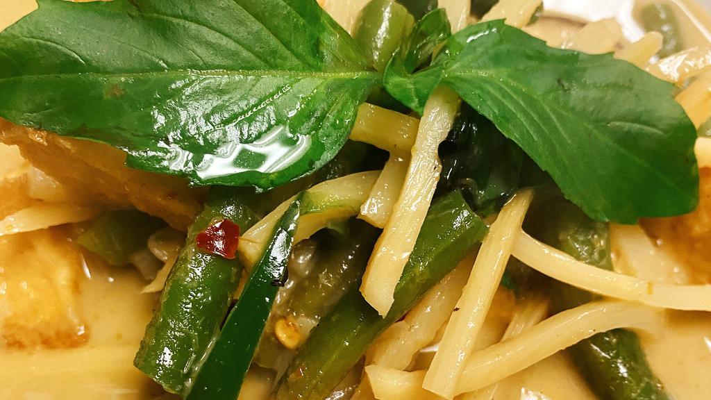 Green Curry · Fresh green chili paste with coconut milk, bamboo shoots, eggplant, bell peppers and basil.