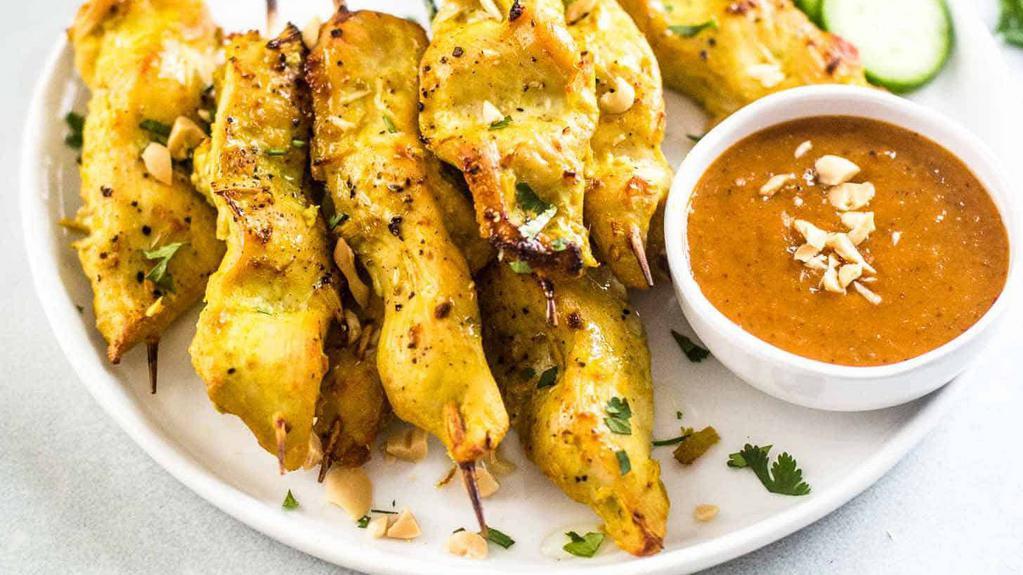 Chicken Satay (Pcs) · Chicken skewered exotic flavorful Thai BBQ marinated in curry powder, coconut milk, Thai herbs and served with peanut sauce and cucumber sauce.