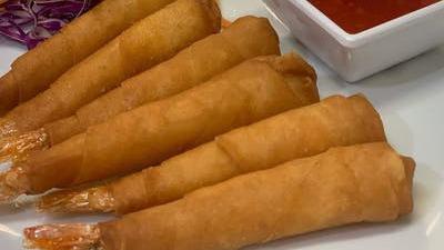 Golden Shrimp (4Pcs) · Deep fried shrimp wrapped with spring roll skin served with three flavor sauce.