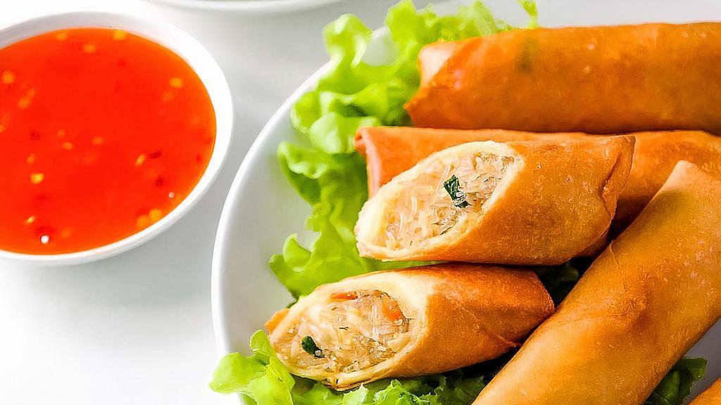 Thai Fried Spring Rolls (4) · Crispy rolls stuffed with chicken, cabbage, carrots, celery and clear noodles served with red chili sauce.