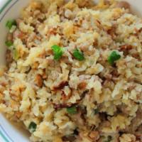 Thai Fried Rice · Thai fried rice with eggs, onions, peas, carrots and scallions.