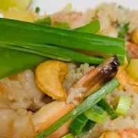 Pineapple Fried Rice · Thai fried rice with chicken and shrimp, pineapple, onions, peas, carrots, scallions, cashew...