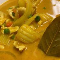 Yellow Curry · Yellow curry paste with coconut milk, potatoes and onions.