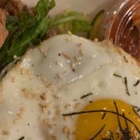 Beef Bibimbap · Served as a bowl of rice topped with assorted vegetables, beef, fried egg stirred together w...