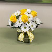 Sweetest Sunrise · Sweet sunny arrangement of yellow roses and white daisies arranged in a clear glass cube.  H...