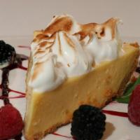 Key Lime Pie · Graham cracker crust filled with light key lime custard, topped with whipped cream