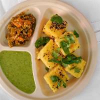 Khaman Dhokla  · savory steamed cake made from gram flour, served with carrot chili and chutney