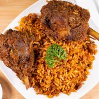 Liberian Jollof Rice · Comparable to Spanish paella but with an unmistakable African flair, this entrée is prepared...