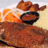 Attieke Fried Fish & Plantain · Couscous cooked to fluffy perfection and served with fried plantain, seasoned fried fish, an...