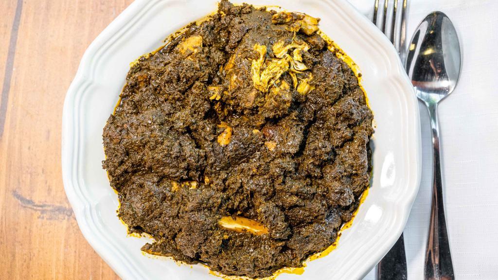 Cassava Leaf · A savory stew made from yucca leaves and cooked in a chicken broth. Seasoned with herbs and spices and cooked with palm oil.  This item cooked with smoked turkey and baked chicken.