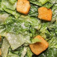 Pan Caesar Salad W/ Side Caesar Dressing · Fresh cut Romaine Lettuce, Croutons, grated parmigian cheese.  Serves 6-8