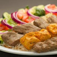 Afghan Platter · Afghani Kabab (beef), Seekh Kabab (beef), Chicken Boti, Kabuli Pulao and Salad and Naan.
