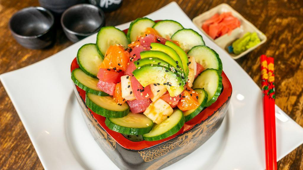 Poke Don · Hawaiian-style dish of ahi tuna, salmon, and yellowtail, served on sushi rice. Served with miso soup and salad.