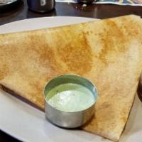 Mysore Masala Dosai · Thin rice crepe with layer of hot chutney filled with potato and onion. Rice and lentil crep...