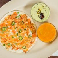 Onion And Peas Uthappam · With tomato and peas toppings. Indian style lentil and rice pancake. Served with sambar a tr...