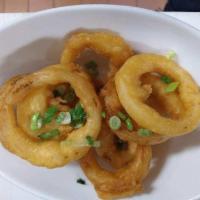 Onion Rings · fresh onion rings dipped in beer batter and deep fried
