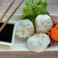 Chive Dumpling (3 Pcs) · Flour dumpling with chives served deep-fried or steamed, served with sauce on the side.